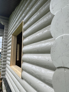 Теплый шов бани оцилиндрованного бревна