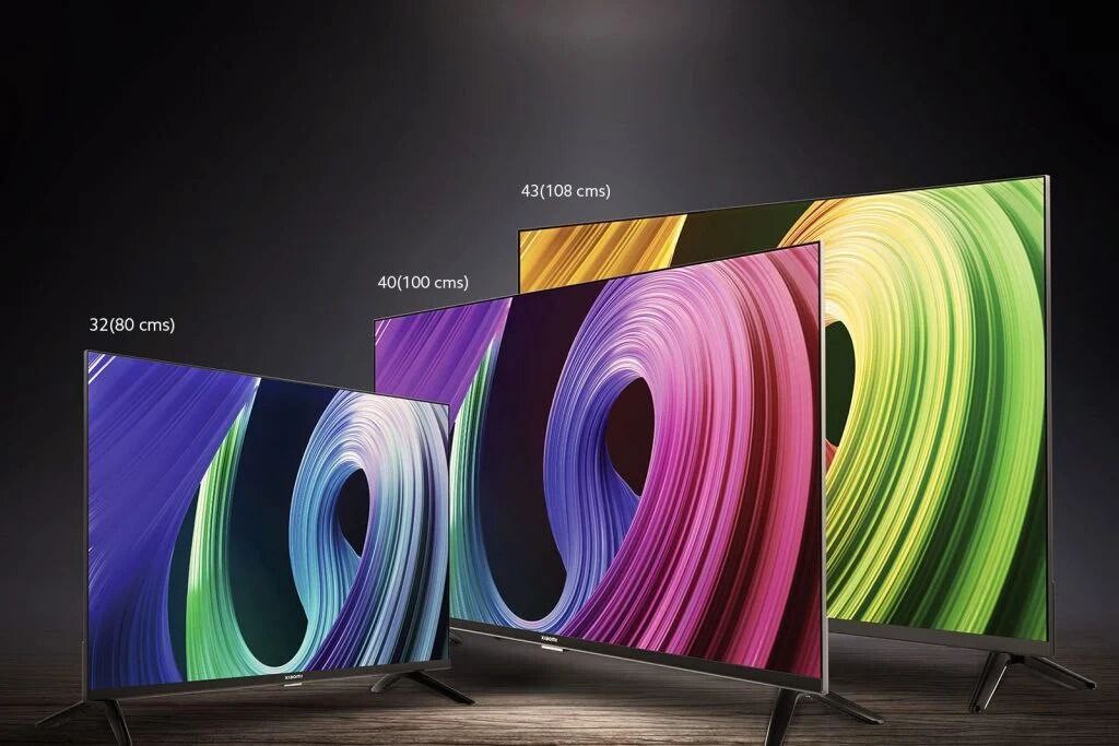 Mi tv a 2025 отзывы. Xiaomi Smart TV. 27 Дюймов телевизор Xiaomi. Xiaomi OLED Vision TV. Самый большой телевизор Xiaomi.