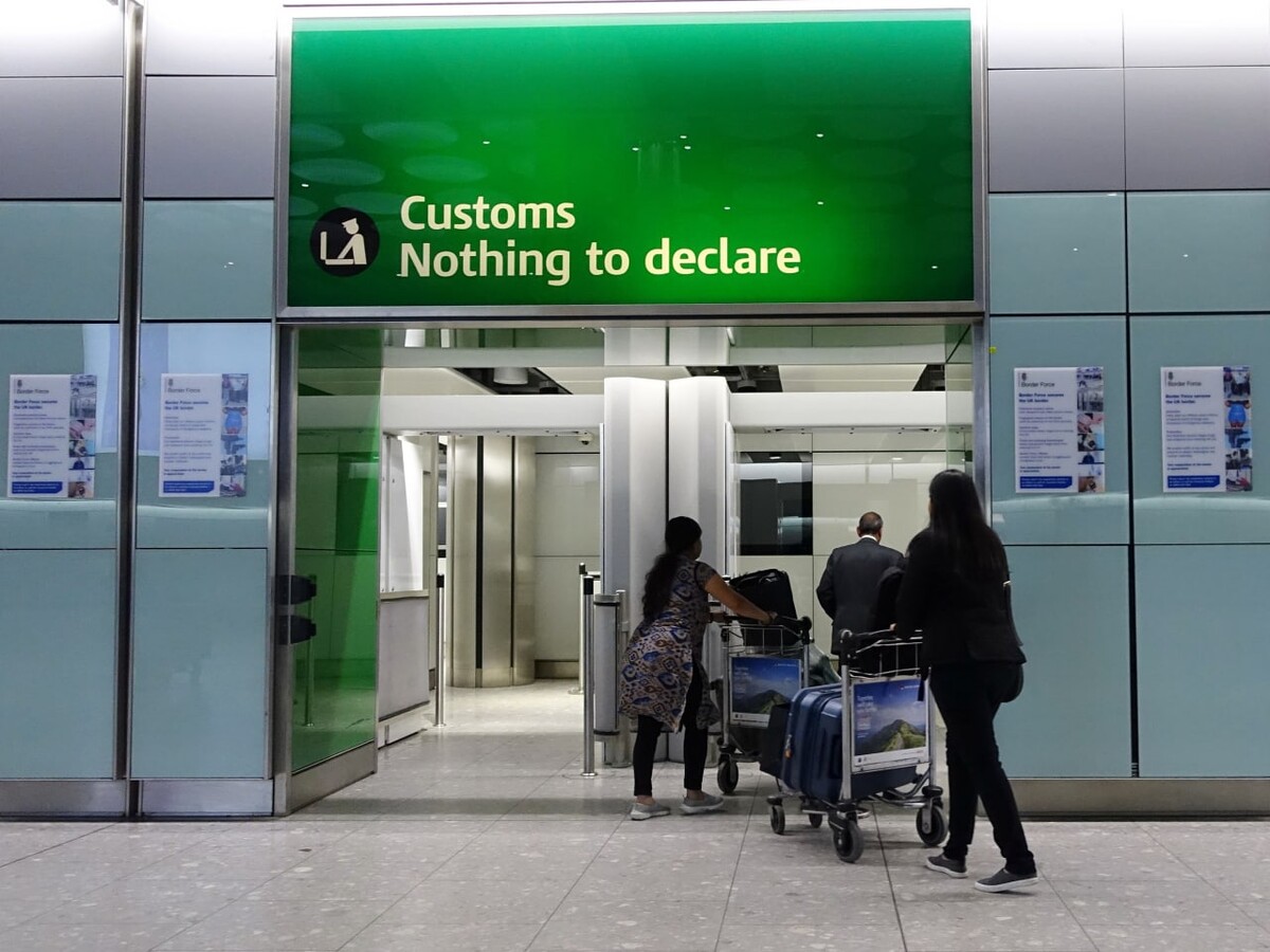 Airport green channel. Customs. Airport red sing goods to. Nothing to declare. Nothing to declare.