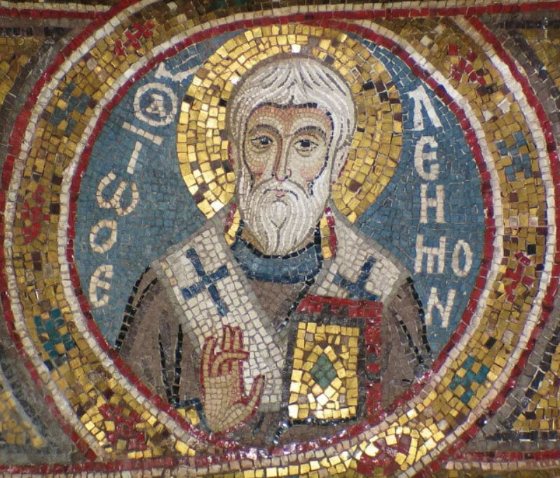 Ἰωάννης ὁ Ἐλεήμονας (Милостивый по-гречески звучит как Элеи́монас).
Мозаика церкви Марторана в Палермо. 1143-51 гг.