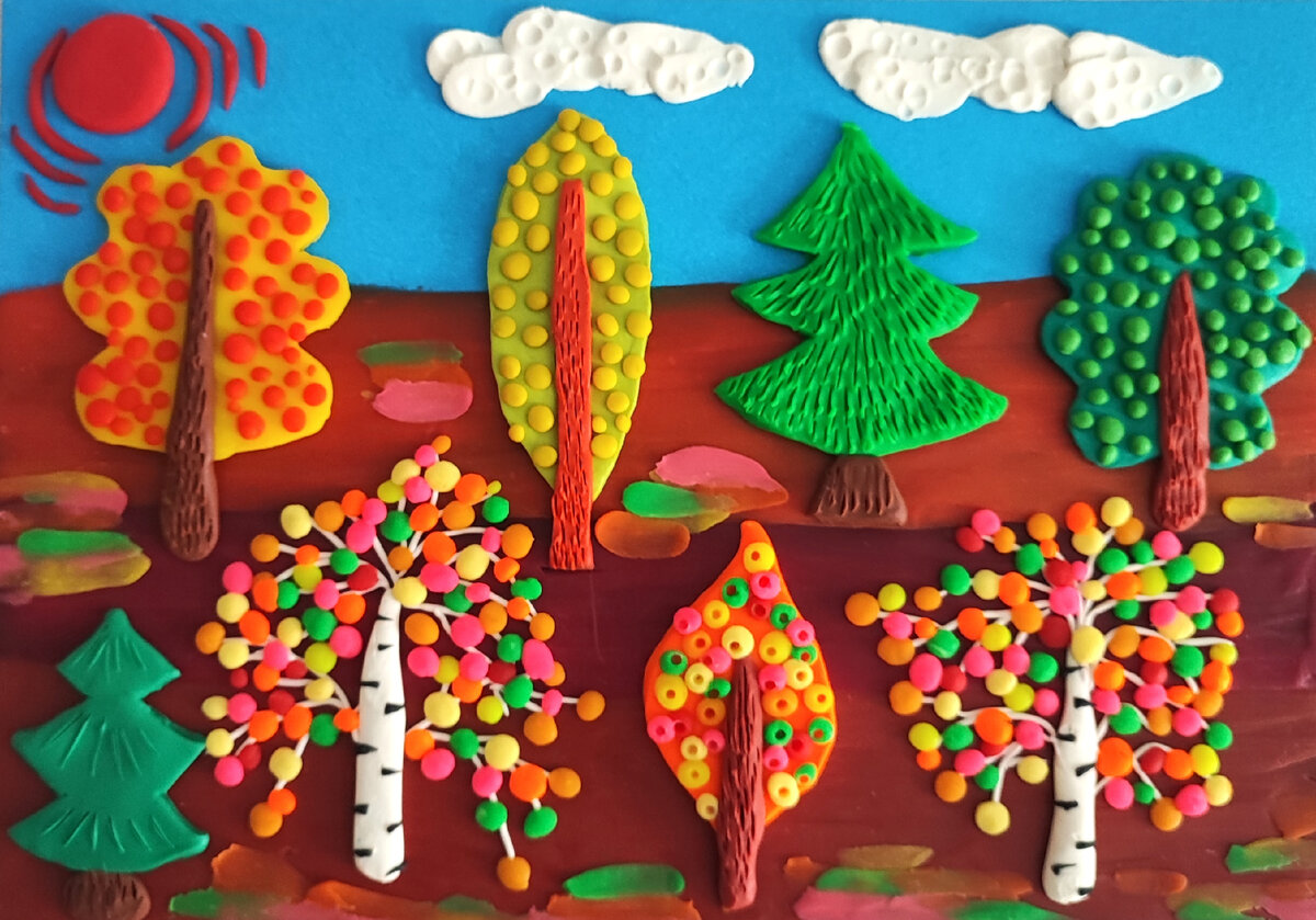 Готовый вариант аппликации из пластилина на цветном картоне " Осенний лес".