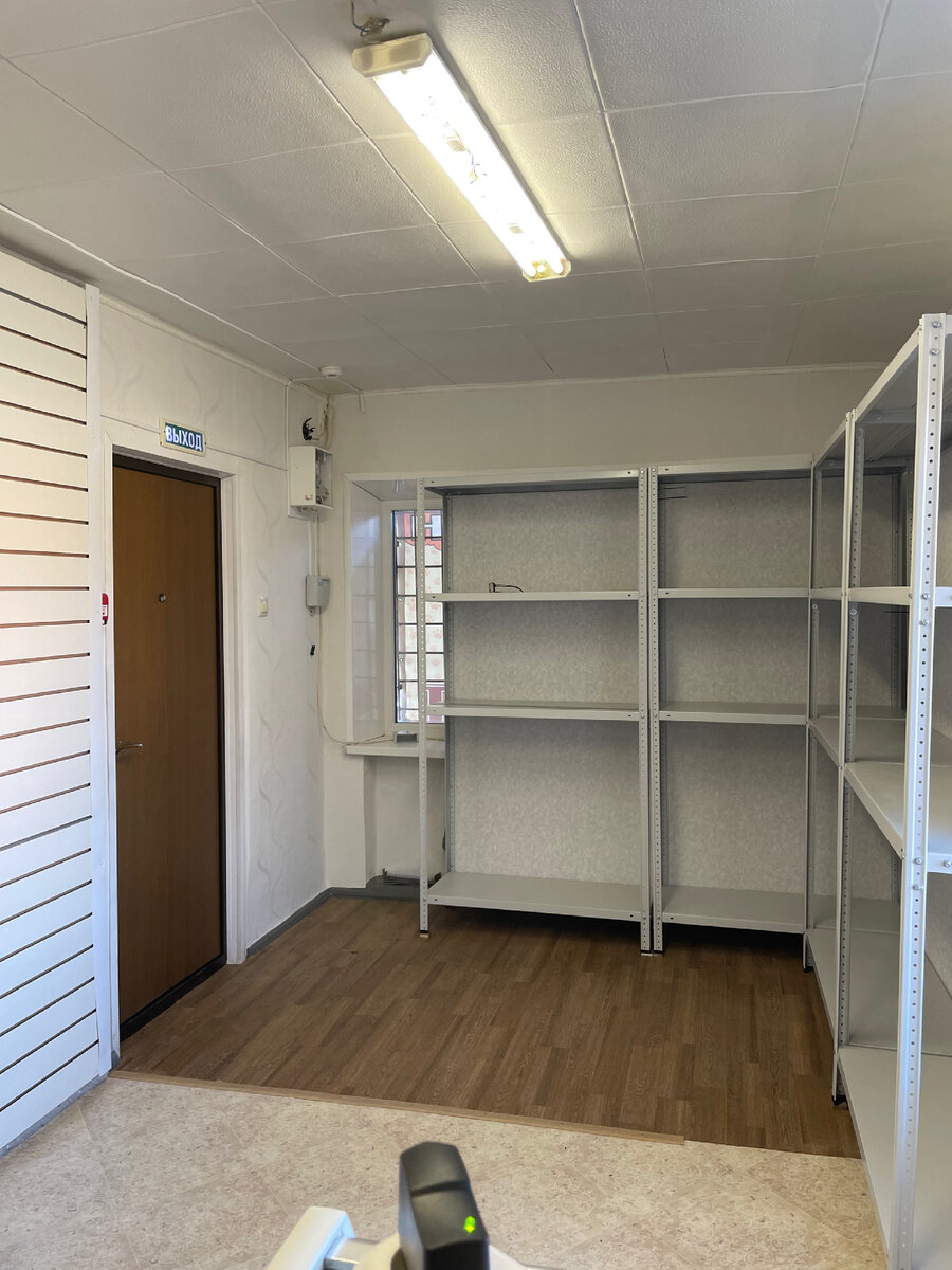 Вот так выглядело помещение после небольшого косметического ремонта и установки стеллажей. 