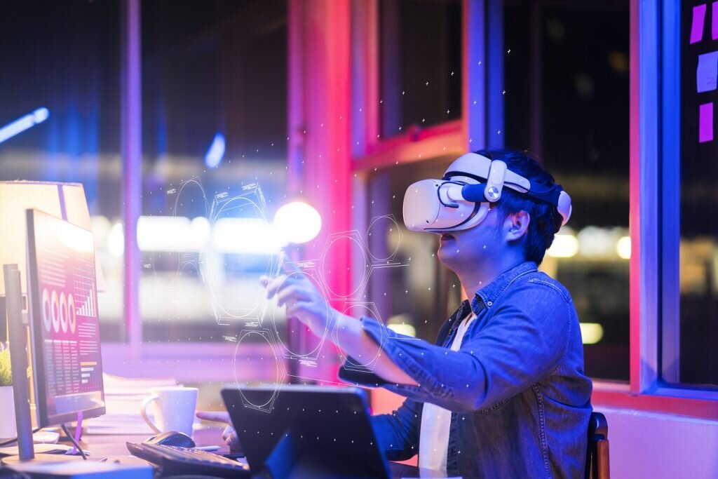    asian young male wearing wearable goggle headset virtual online meeting digital space working with 3d augmented dimension at home,cyber virtual working with virtual vr goggle and pc desktop device Дмитрий Смирнов