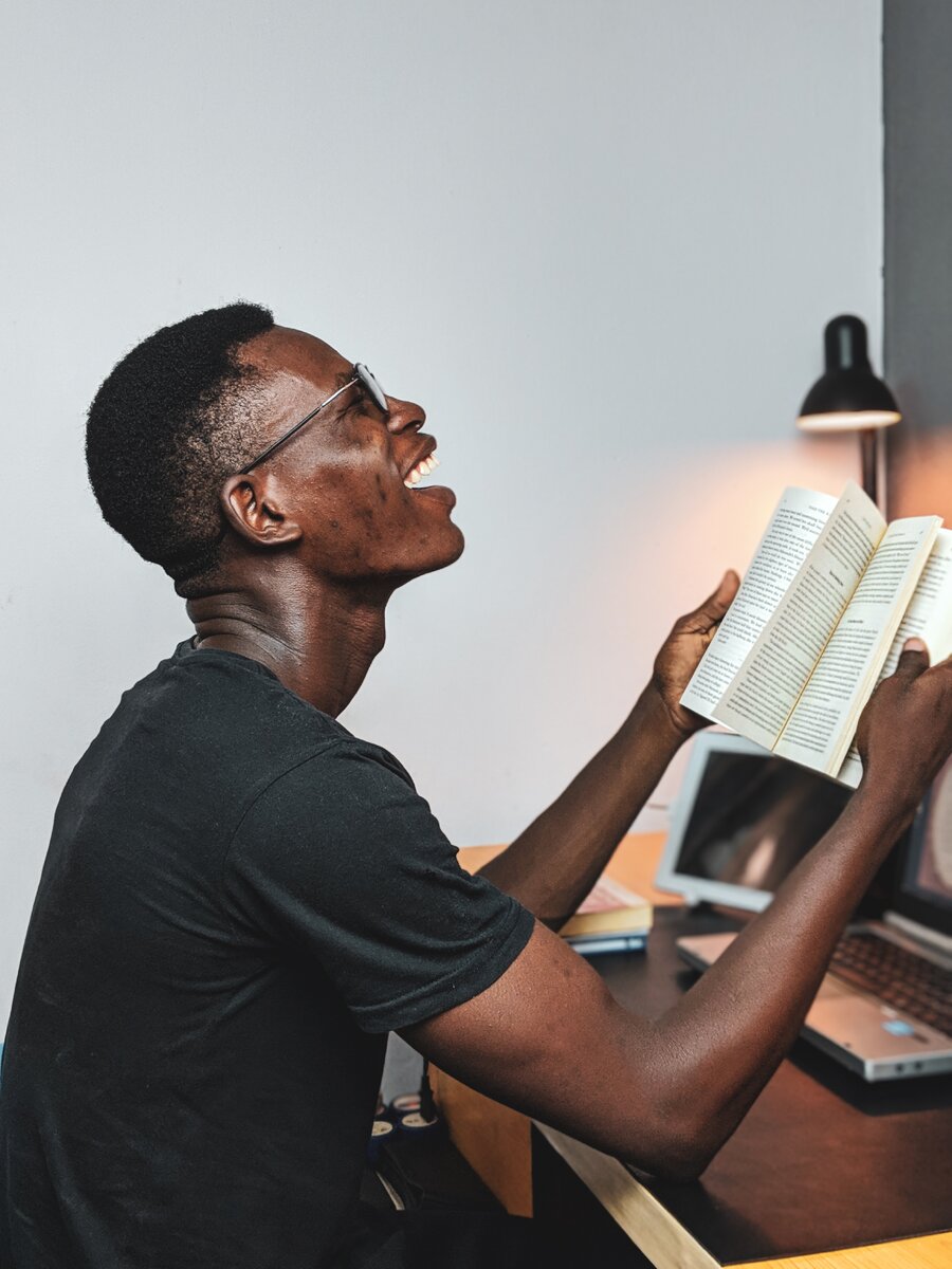 https://www.pexels.com/photo/man-reading-a-book-2682763/