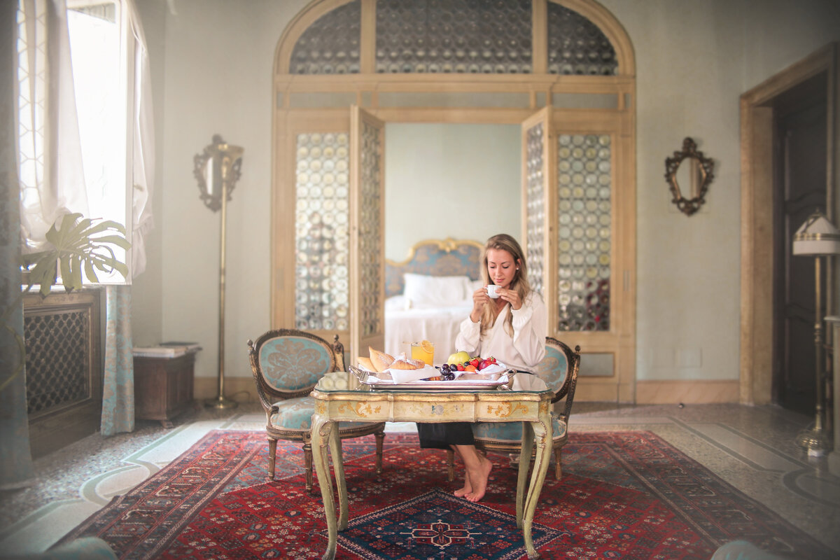 Photo by Andrea Piacquadio: https://www.pexels.com/photo/woman-enjoying-breakfast-in-luxury-hotel-room-3771827/