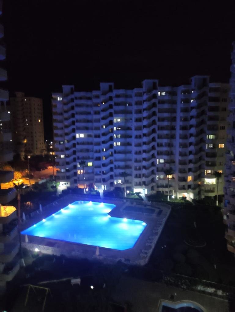 Такой вид из окна летом, когда включают подсветку в бассейне.