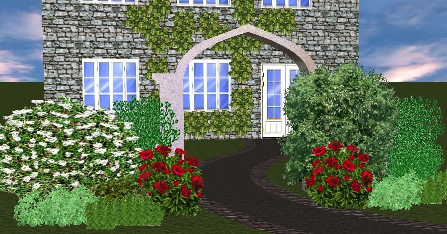 Цветник у садовой арки в мае