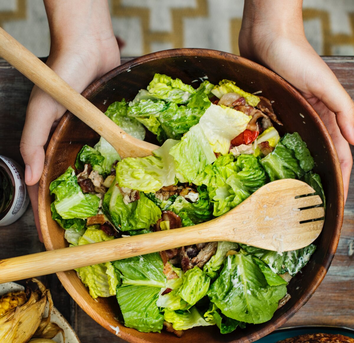 https://www.pexels.com/photo/person-holding-brown-wooden-bowl-with-vegetable-salad-inside-1260307/