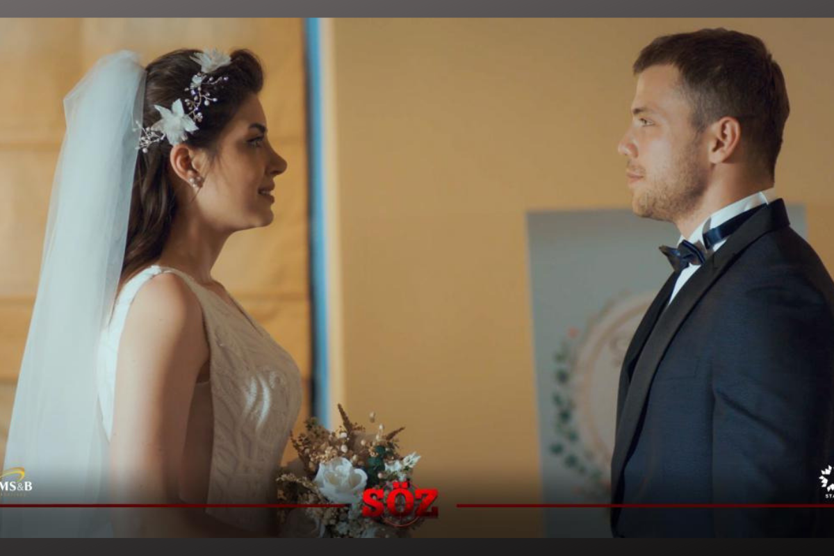 На фото кадр из турецкого сериала "Обещание", в главных ролях Толга Сарыташ и Дениз Байсал