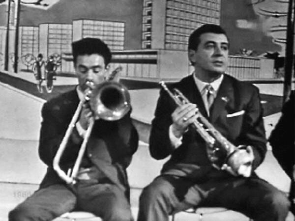 Владимир Чижик справа. Труба Владимира Чижика солировала во многих фильмах и мультфильмах: "Операция "Ы", "Кавказская пленница", "Романс о влюбленных", "Бременские музыканты", "Ну, погоди", "Варежка" и др. 
Фото с сайта https://www.kino-teatr.ru.