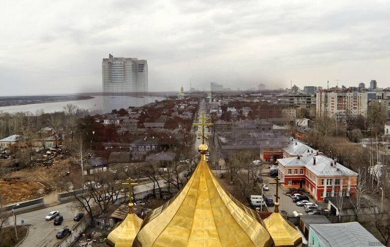 коллаж исторического и современного вида (2014 год) со Слудской колокольни