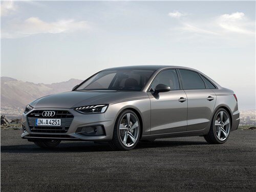 Пятая генерация Audi A4 с внутризаводским индексом B9 дебютировала в 2015 году, а спустя четыре года, на закрытой выставке в Ингольштадте, немецкий производитель продемонстрировал обновленную версию семейства. Стоит отметить, что новинка является первым, но очень глубоким рестайлингом. Автомобиль получил модернизированную линейку силовых агрегатов, измененную компоновку центральной панели, несколько дополнительных опций и перекроенный экстерьер. Несмотря на то, что визуально, автомобиль не получил радикальных изменений, большинства навесных панелей у него абсолютно новые. От предшественника остался только капот, крыша и крышка багажника или пятая дверь, в случае с универсалом. На передней части можно увидеть уменьшенную решетку радиатора. Она сохранила свою шестиугольную форму, однако, лишилась хромированных ребер. Фары головного освещения также с новой начинкой. По умолчанию светодиодные, а за дополнительную плату матричные с адаптивным дальним светом. Изменились и секции дневных ходовых огней. На корме можно увидеть новые стоп-сигналы с необычной графикой и пару массивных патрубков выхлопной системы.

РАЗМЕРЫ
Ауди А4- пятиместный среднеразмерный автомобиль премиум сегмента. Он выпускается в двух вариантах исполнения: четырехдверный седан и универсал. После рестайлинга, его габаритные размеры составляют: длина 4762 мм, ширина 1847 мм, высота 1428 мм для седана и 1435 мм для универсала, а колесная база- 2820 миллиметров. В основе модели лежит модульная платформа MLB. Она подразумевает полностью независимую многорычажную компоновку подвески. В начальных версиях по кругу устанавливаются обычные амортизаторы двустороннего действия, а за дополнительную плату, можно заказать адаптивные стойки с комфортным и спортивным режимами работы. Что касается размера багажника, то седан способен предложить до 460 литров. Универсал несколько вместительнее. При поднятых спинках второго ряда и загрузке под верхнюю полку, сзади остается около 495 литров. Если пожертвовать задними местами, можно получить до 1495 литров.

ТЕХНИЧЕСКИЕ ХАРАКТЕРИСТИКИ
На старте продаж анонсировано пять различных силовых агрегатов. Бензиновые Audi A4 получат линейку двухлитровых турбированных четырехцилиндровых моторов. Базовые версии развивают 150 и 190 лошадиных сил и 270-320 Нм крутящего момента. С ними в комплекте идут только семиступенчатые преселективные роботизированные коробки с двумя сцеплениями S tronic. Привод исключительно передний. Старшие версии получат более производительный мотор на 245 лошадей и 370 Нм тяги. Он работает с такой же коробкой передач и фирменной системой полного привода Quattro. Дизельные версии представлены в двух вариантах. Первый- это рядная четверка с турбонаддувом на 190 сил и 400 Нм с роботизированной КПП. Также есть более мощный вариант с V-образной шестеркой. Она генерирует 231 лс и 500 Нм. В качестве трансмиссии выступает классический восьмиступенчатый гидромеханический автомат и система полного привода.

ОСНАЩЕНИЕ
Основным изменением в салоне Audi A4 стала обновленная мультимедийная система. Она получила увеличенный экран (10,1 против 8,3 дюйма у предшественника). Более того, он стал сенсорным. Для более приятных тактильных ощущений, производитель установил небольшую пружину. Также с центральной консоли пропал контроллер, который раньше отвечал за управление. Изменилась опциональная виртуальная панель приборов. У нее увеличился функционал и разрешение изображения. Из прочих изменений стоит отметить новое рулевое колесо, расширенный список отделочных материалов и фоновую подсветку салона.