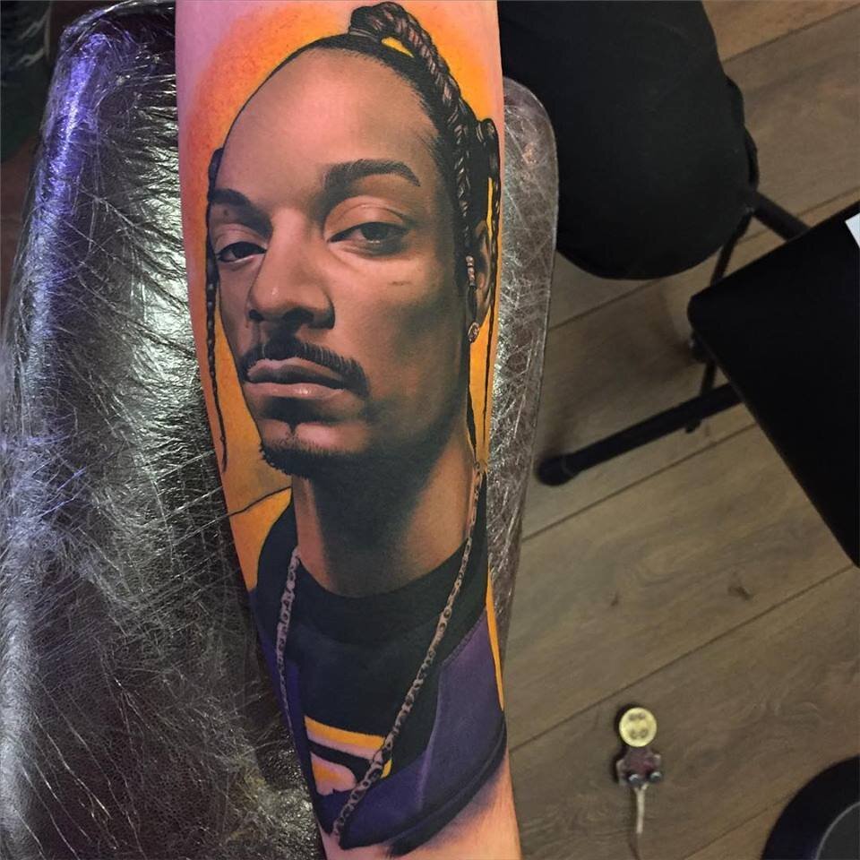 Snoop Dogg’s 6 Tattoos & Their Meanings