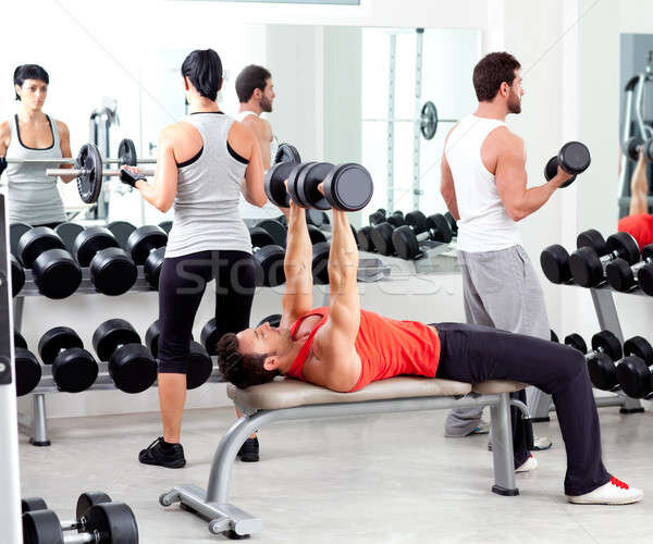 https://img3.stockfresh.com/files/l/lunamarina/m/23/1523726_stock-photo-group-of-people-in-sport-fitness-gym-weight-training.jpg