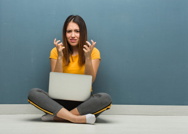 https://image.freepik.com/free-photo/young-woman-sitting-floor-with-laptop-angry-upset_1187-25278.jpg