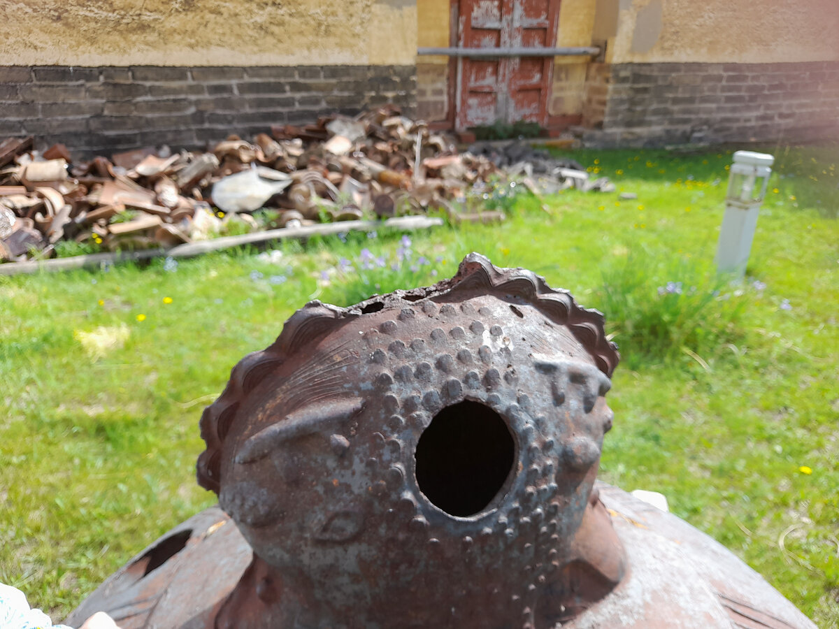 Навершие колокола на территории.