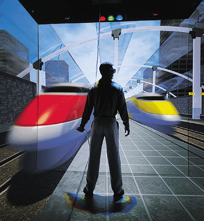 Симуляция новых объектов. CAVE используется для моделирования новой железнодорожной станции, чтобы оценить ее функциональность. (Изображение  Fakespace Systems Inc.)