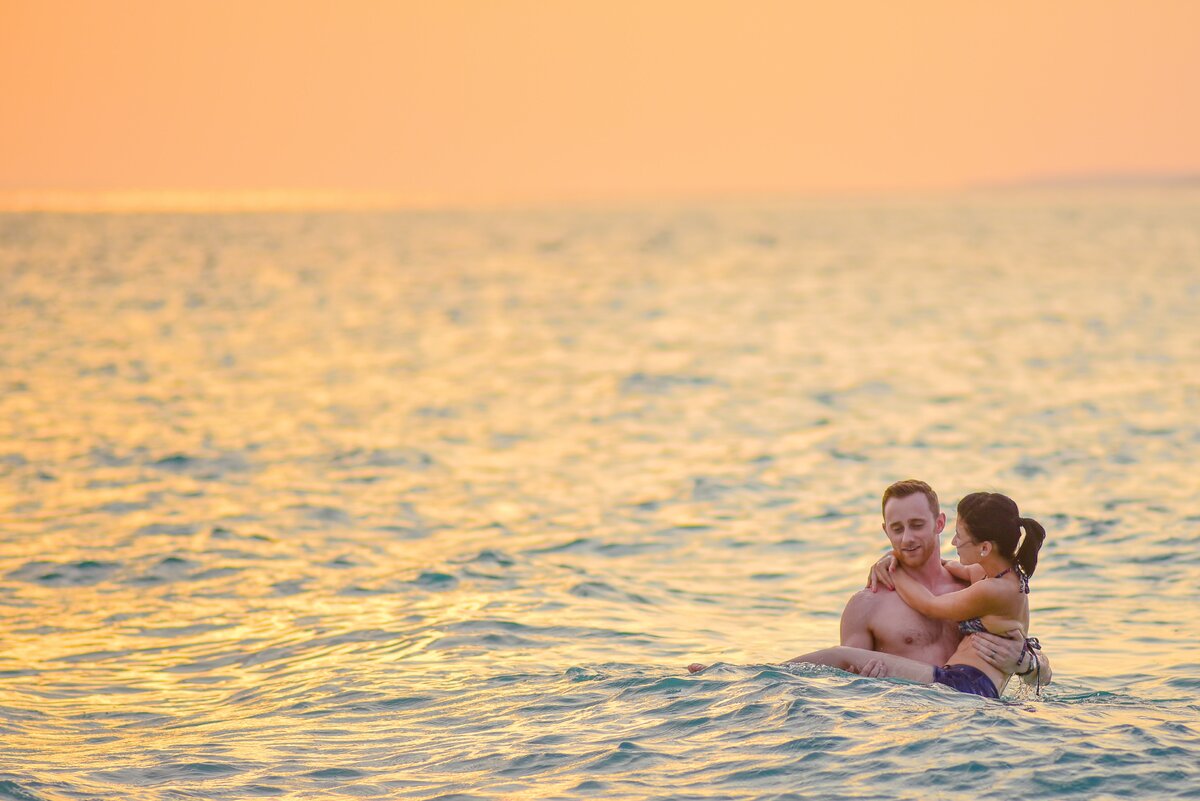 https://www.pexels.com/photo/man-and-woman-swimming-in-a-beach-1024990/