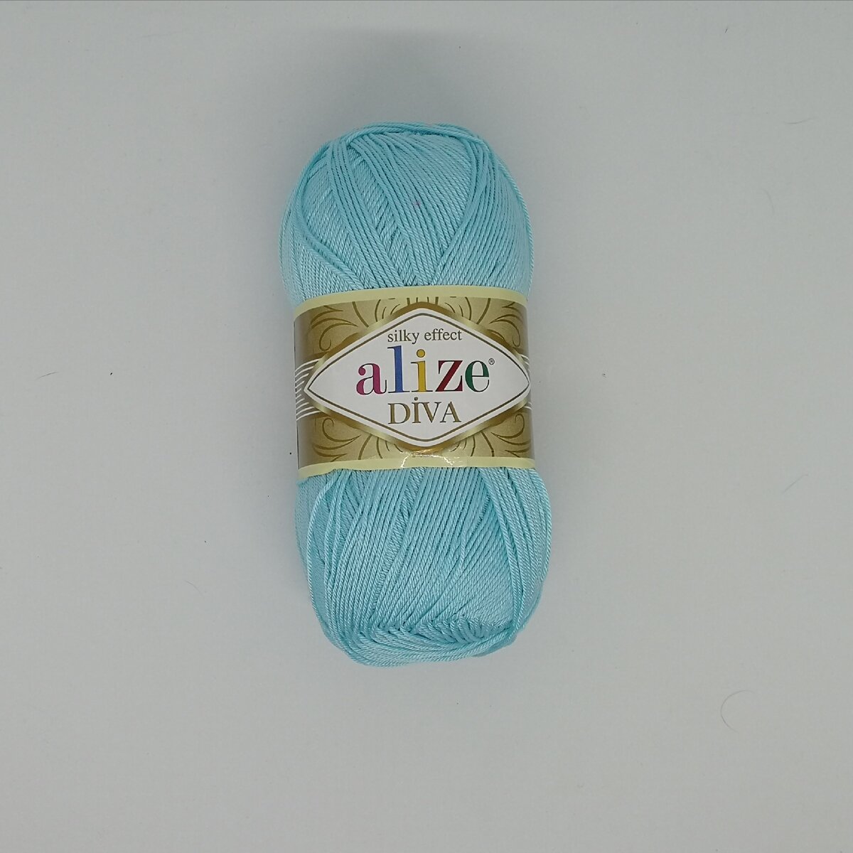 Мой моточек, которого хватило на кукольные: платье, шапку, сапожки и пелерину.