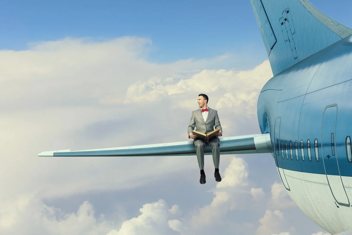 More people are flying. Человек на крыле самолета. Человек сидит на крыле самолета. Люди в самолете. Верхом на самолете.