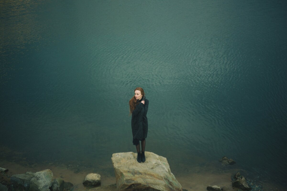 https://pixabay.com/photos/woman-standing-rock-water-1082056/