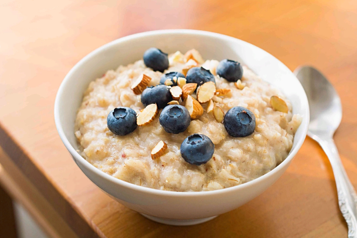 Girl serve porridge