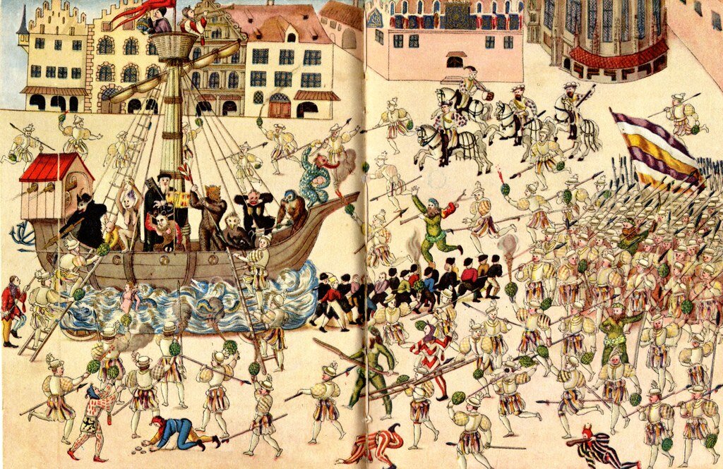 Нюрнбергский шембартлауф — ход ряженых — средневековый "воцерквленный карнавал" кануна Великого поста, проводившийся с 1449 по 1539 г. Штурм «ада» — кульминация масленичного шембартлауфа. Нюрнберг, 1539 г. / Vom Schembartlaufen. Hrsg. von Fritz Brüggemann. Leipzig: Bibliographisches Institut, 1936. Der Sturm auf die Schembarthölle des Jahres 1539. Schembartbuch der Pickertschen Sammlung. Handschrift, Nürnberger Stadtbibliothek, Nor. K. 444.