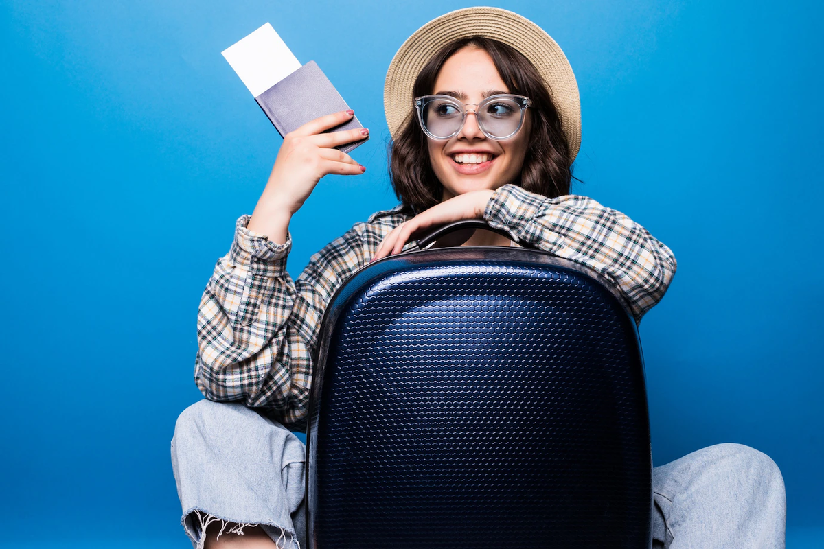 https://www.freepik.com/free-photo/portrait-excited-young-woman-dressed-summer-clothes-holding-passport-with-flying-tickets-while-standing-with-suitcase-isolated_10136934.htm