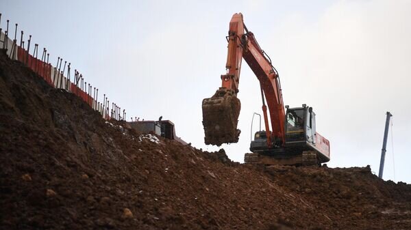    Экскаватор на строительстве станции метро© РИА Новости / Илья Питалев