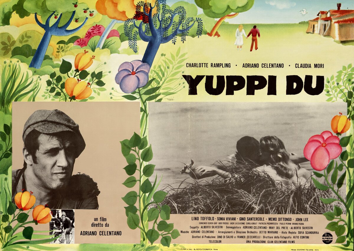 На фотографии постер к фильму Yuppi du