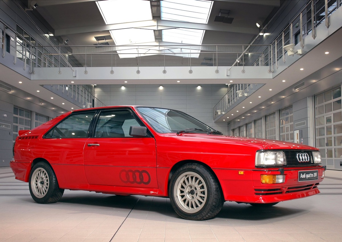 В один из обычных дней одному человеку из советов директоров надоело что компания находиться в тени . В 1977 году в Финляндии проходил испытание внедорожник iltis всех поразила его проходимость и управляемость в тяжёлых условиях и тут Фердинанд Карл Пих сказал: А давайте перенесем всё ходовую от внедорожника в лёгкое спортивное купе . Когда инженеры пришли в себя от такой идеи работа пошла и вот в 1980году они выпускают её все были просто в шоке как можно было установить в небольшую машину всю ходовую часть от внедорожника . Конкуренты сначало смеялись ит говорили что машина будет слишком тяжёлая и сложная но к счастью ауди их не слышали. И вот в начале 1981 в январском ралли в Австралии экипаж выиграл гонки больше чем 9 минут у второго места это же просто пропасть по меркам автоспорта гонщик заявил что это машина изменить мир ралли и он был прав . С его слов- это машина просто монстр у неё просто мощнейшее ускорение  а при прохождение поворота машина не просто скользила при прохождении поворота а буквально сама себя вытаскивала  я прекрасно чувствовал как передние колёса тянут машину. А дальше ещё веселее создали Audi Sport Qattro.  Машина была создана для ралли группы Б , а вот гражданская версия ускорилась до 100 км/ч за 4,7 сек для тех лет быстрее не мог не кто не Феррари не ламборгини не  могли а раллийная модификация могла выстреливать и за 3,6 секунд. Но в 1994 году они собрали самое злое чудовище за всю история мира ралли Audi Sport Qattro C1  до это машины не когда не были такие быстрые 550 лс на 1090 кг когда у гонщика спросили как вам машина он ответил : Мне кажется я думаю слишком медленно для это машины 