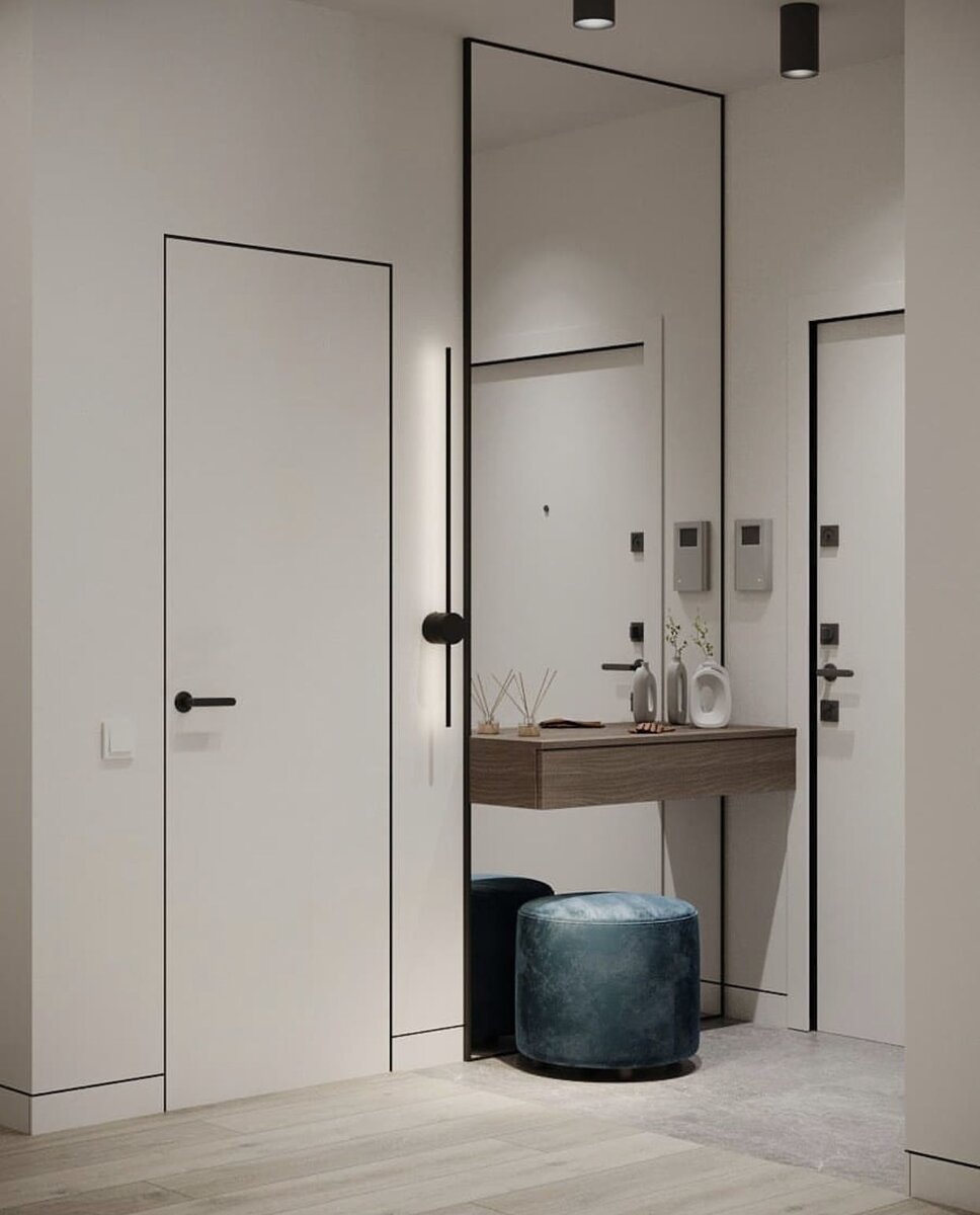 Стык скрытого плинтуса и скрытой двери в минималистичном интерьере