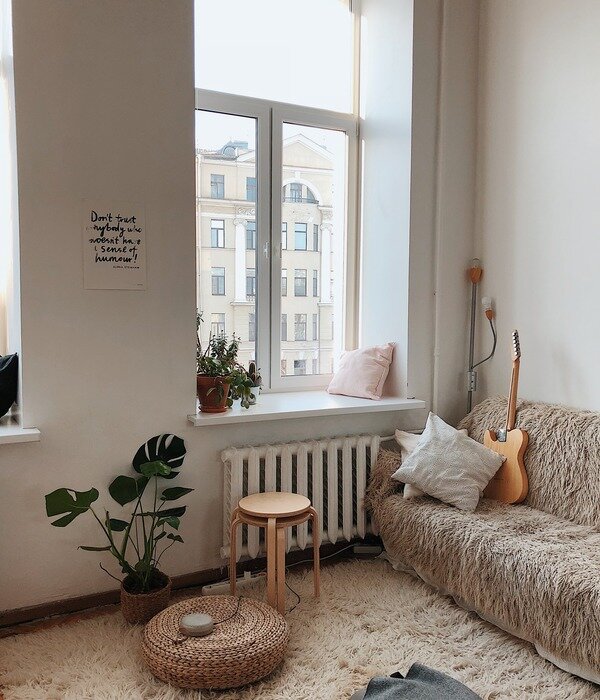 https://www.pexels.com/photo/round-brown-wooden-stool-near-brown-sofa-892618/