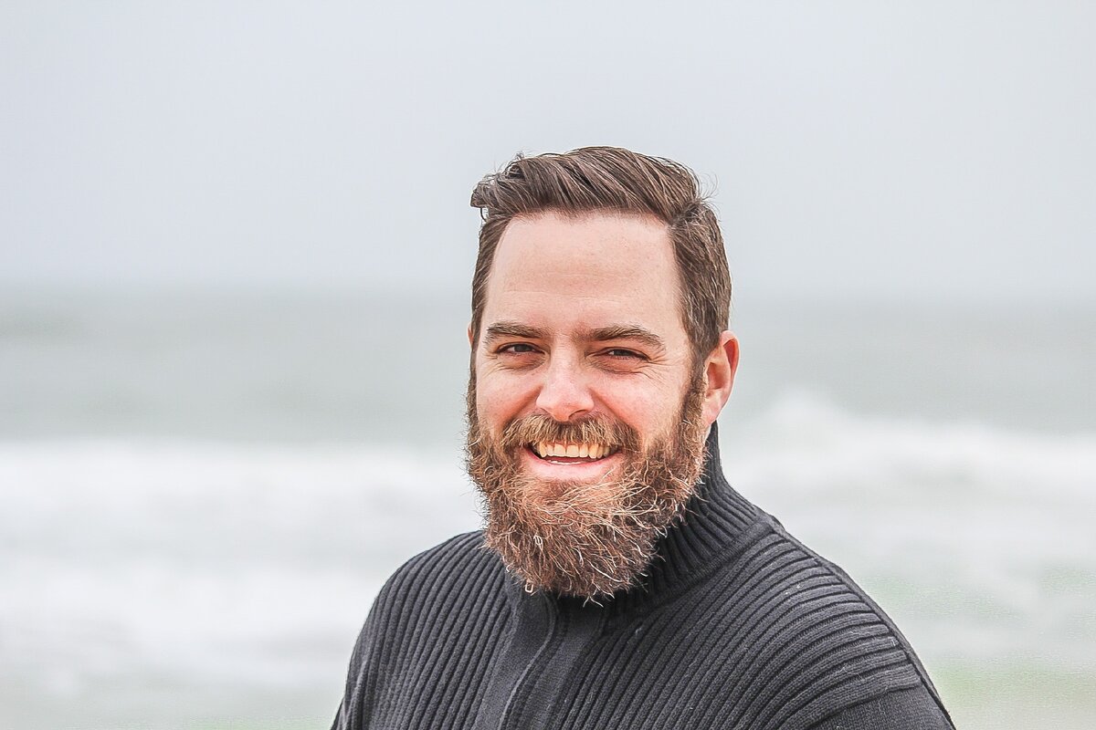 https://www.pexels.com/photo/man-wearing-black-zip-up-jacket-near-beach-smiling-at-the-photo-736716/