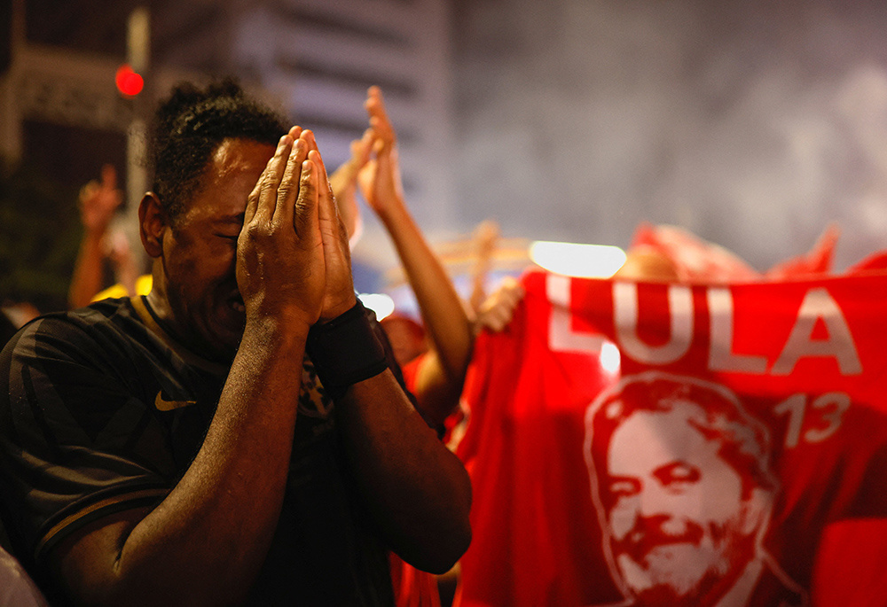 A supporter of Luiz Inacio Lula da Silva reacts as he celebrates election results proclaiming Lula the winner, in S„o Paulo, Brazil, Oct. 30, 2022. (CNS photo/Amanda Perobelli, Reuters)