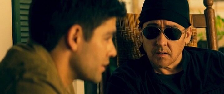 Кадр из фильма "Арсенал", где Кьюсак встретился с другим незадачливым бэшником - Николасом Кейджем.