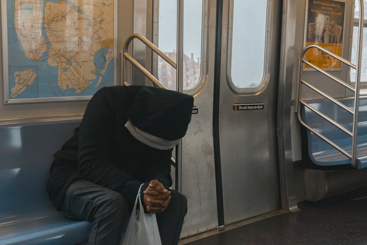 Source: https://www.pexels.com/photo/person-in-black-hoodie-sitting-on-train-bench-362948/