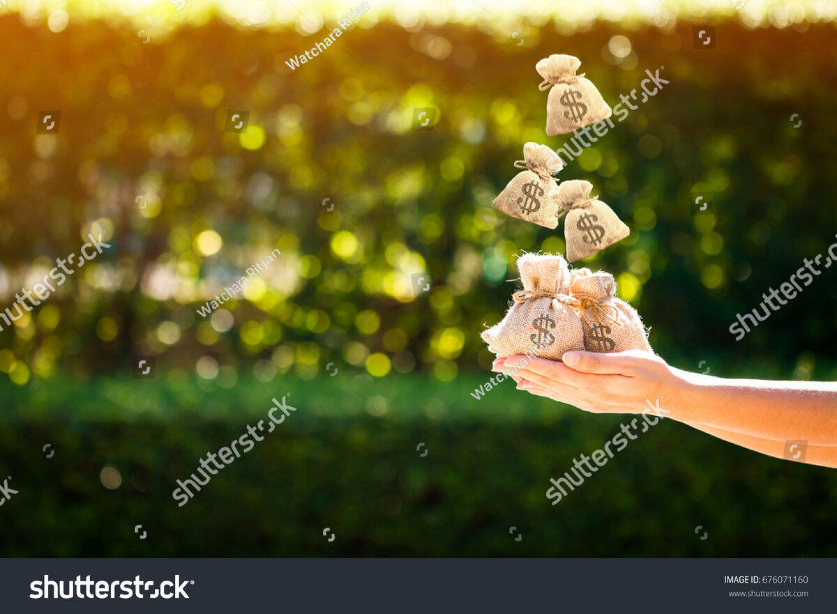 https://image.shutterstock.com/z/stock-photo-women-hands-hold-a-money-bags-and-dropping-on-the-top-in-the-public-park-for-loans-to-planned-676071160.jpg