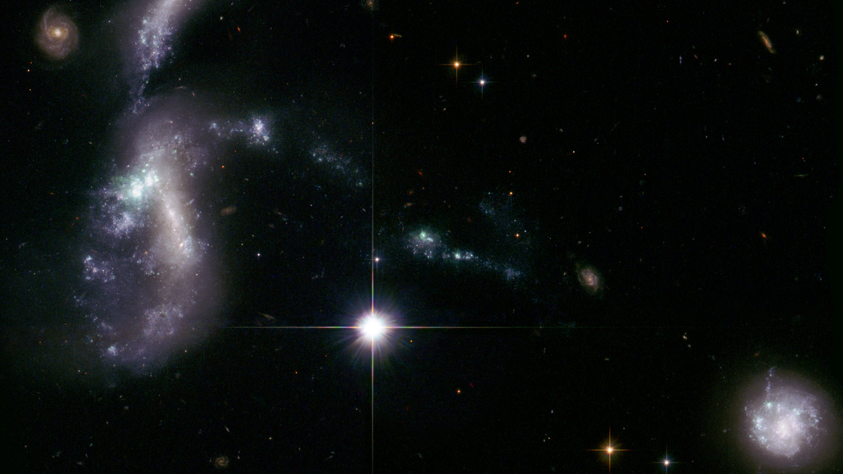 Hickson Compact Group 31 \\ NASA, ESA, J. English (University of Manitoba), and the Hubble Heritage Team (STScI/AURA)