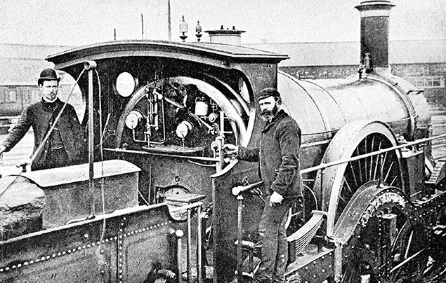 A photograph of the locomotive named the ‘Iron Duke’, with two engineers on board.