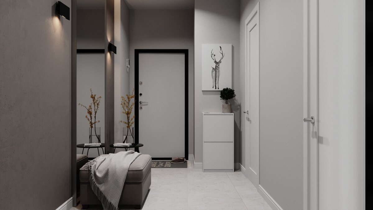 Дверные наличники, бра и столик в чёрном цвете добавляют акценты в нейтральный интерьер прихожей 
