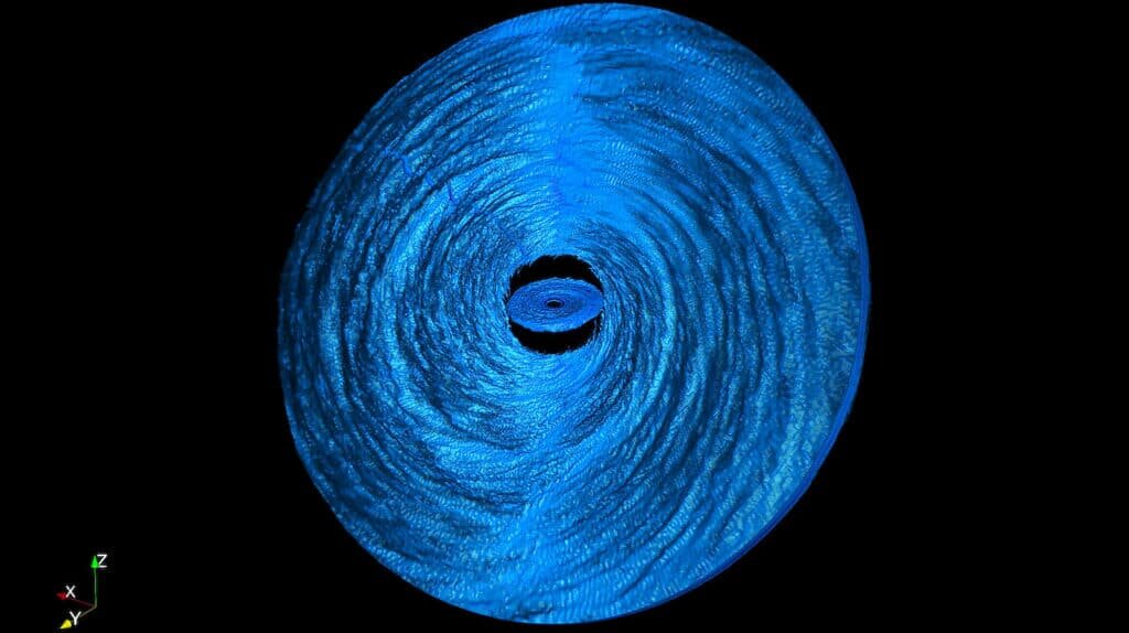    Аккреционный диск вокруг сверхмассивной черной дыры разорван на два субдиска — внутренний и внешний. На внешнем видны волны напряжений, возникающие из-за того, что он вращается не соосно с черной дырой. Внутренний субдиск уже ориентирован с плоскостью вращения черной дыры / © Nick Kaaz, Northwestern University