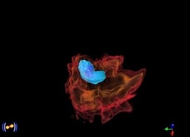 Снимок из центральной области численного моделирования двух сливающихся нейтронных звезд. На нем изображены звезды, растянутые приливными силами непосредственно перед их столкновением.