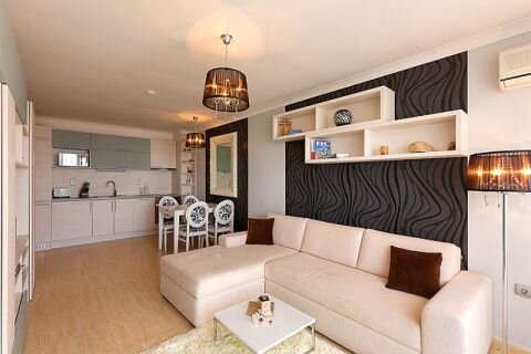 Использование камина для создания уюта и теплаПросторная и светлая кухня, совмещённая с гостиной в студии