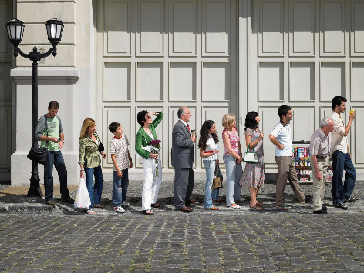 Stand in queue. Люди в очереди. Стояльщик в очереди профессия. Люди стоят в очереди. Очередь фото.
