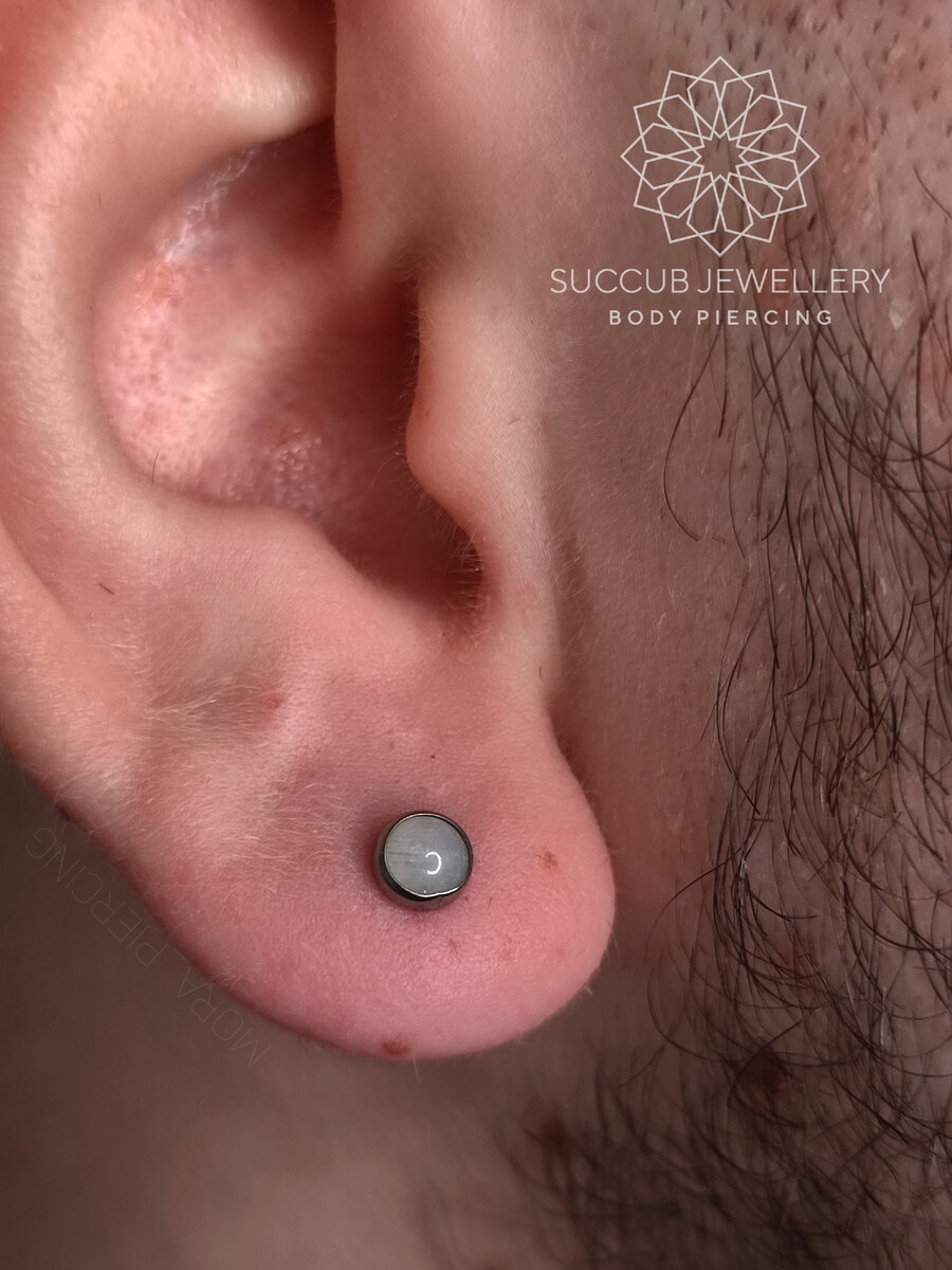 Прокол мочки с лунным камнем в моем исполнении