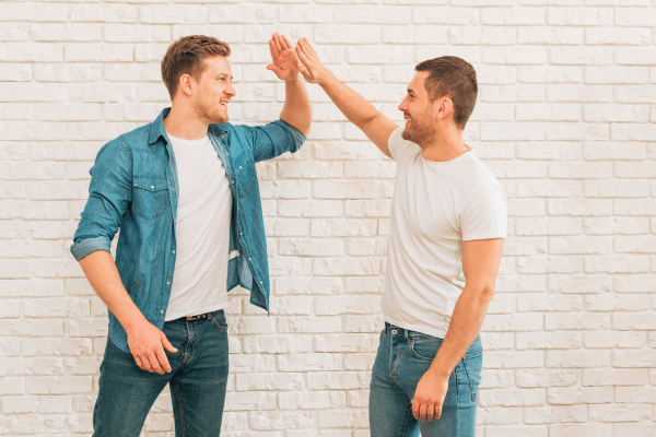 https://ru.freepik.com/free-photo/two-male-friends-giving-high-five-to-each-other-against-white-brick-wall_4569658.htm#query=two%20man&position=35&from_view=search&track=ais