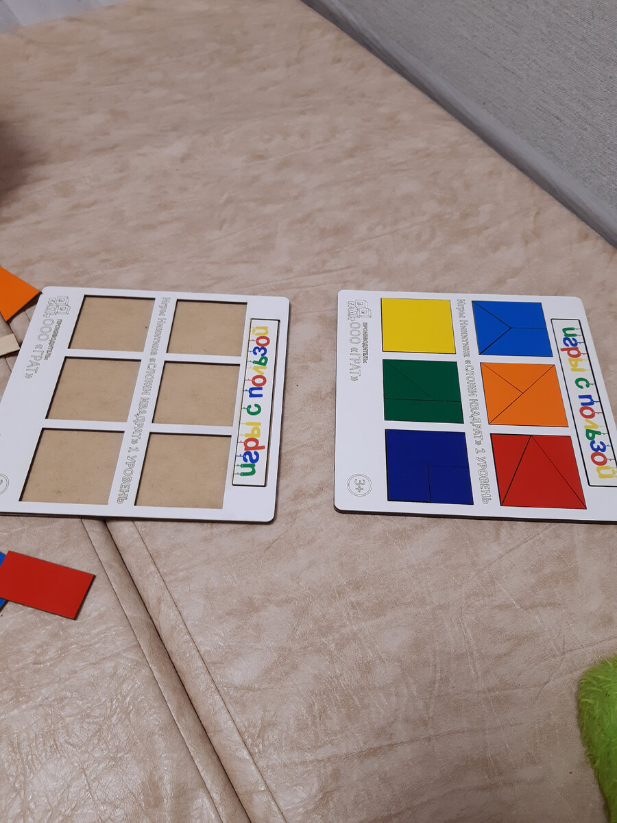 Квадраты Никитина папа тоже помогает дочке собирать.