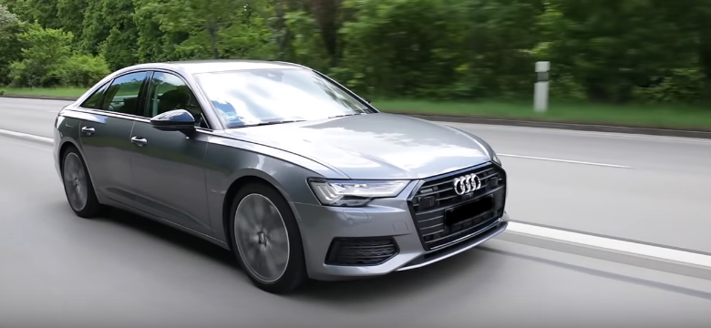 Видно переднюю и боковую часть кузова модели Audi A6 55 TFSIe.
