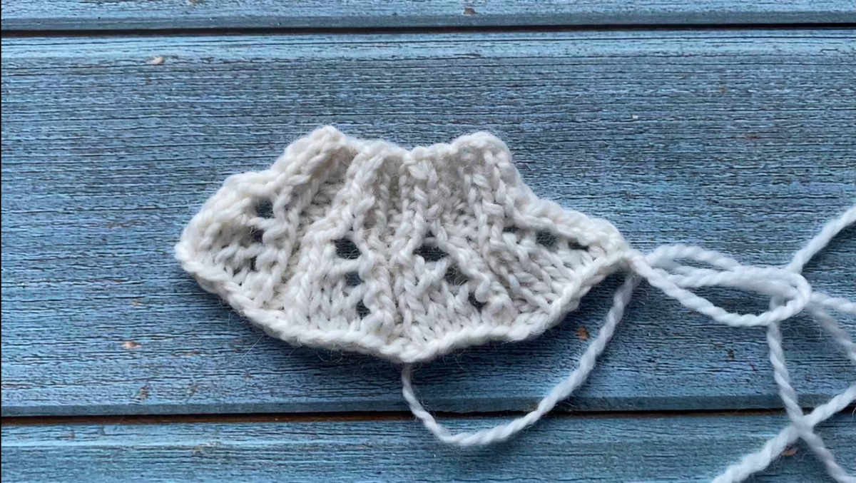 Узор в виде рюши для обработки низа вязанного изделия